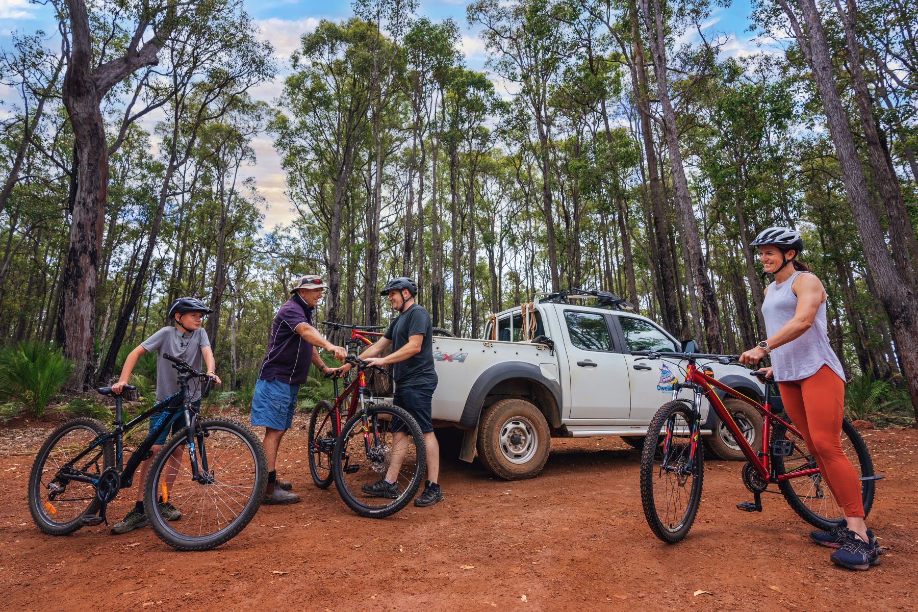 Support vehicle unloading bikes at forest trailhead for Munda Biddi ride