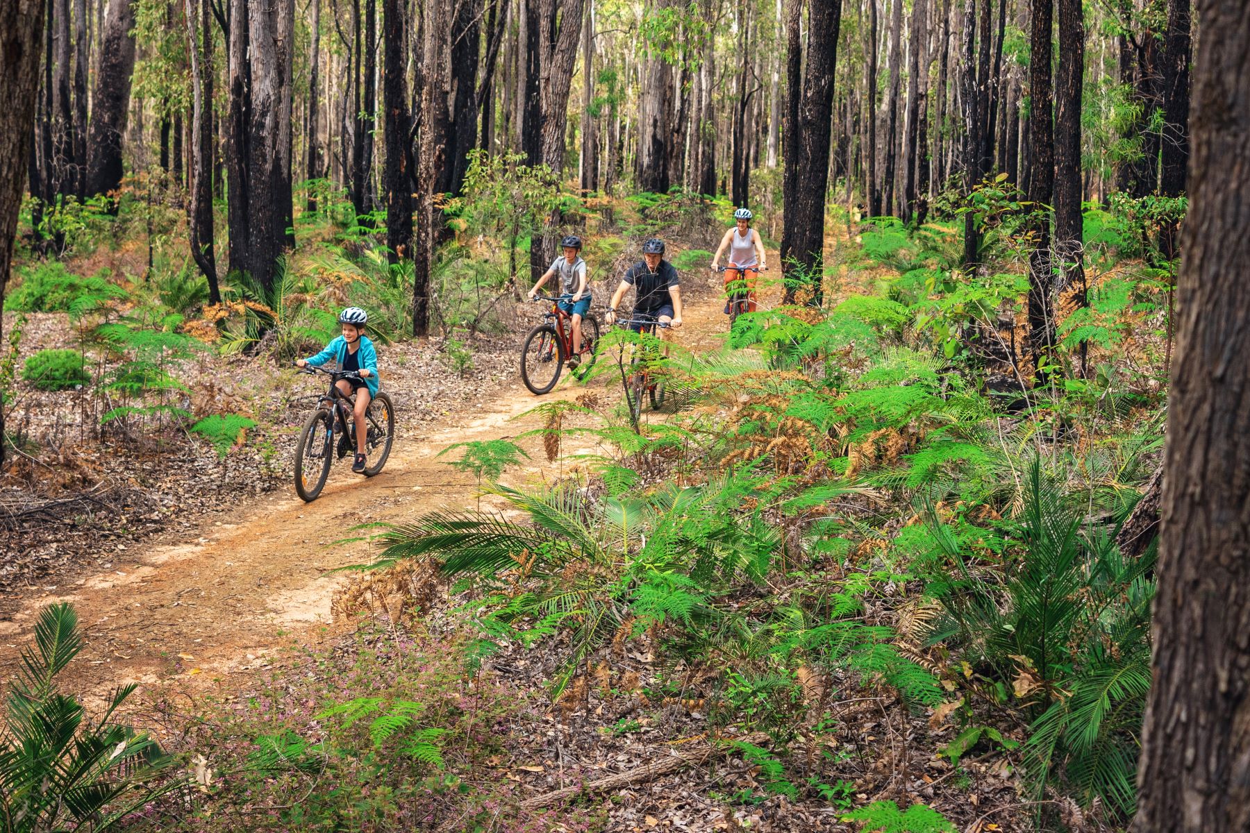 Young riders enjoying a fast, flowing trail in Murray Valley bike network