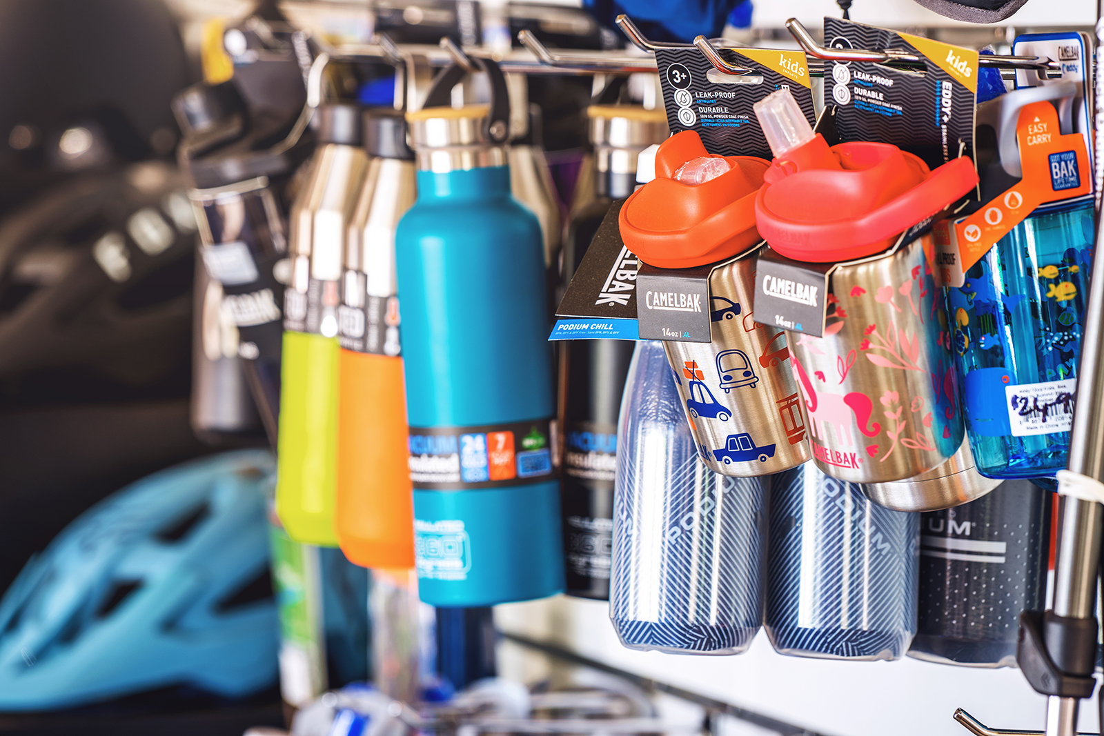 Hiking flasks, drink bottles, and gas canisters on hanging display Dwellingup Trail shop