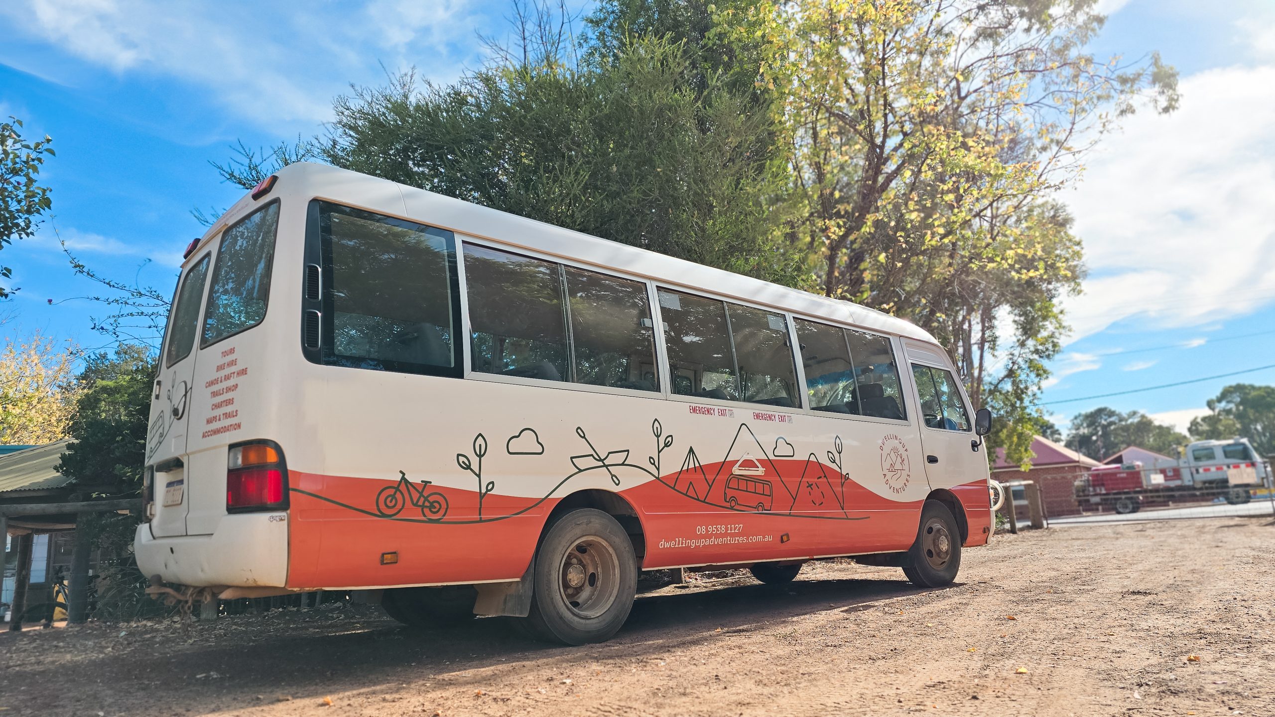 Charter shuttle bus showing outdoor adventure branding
