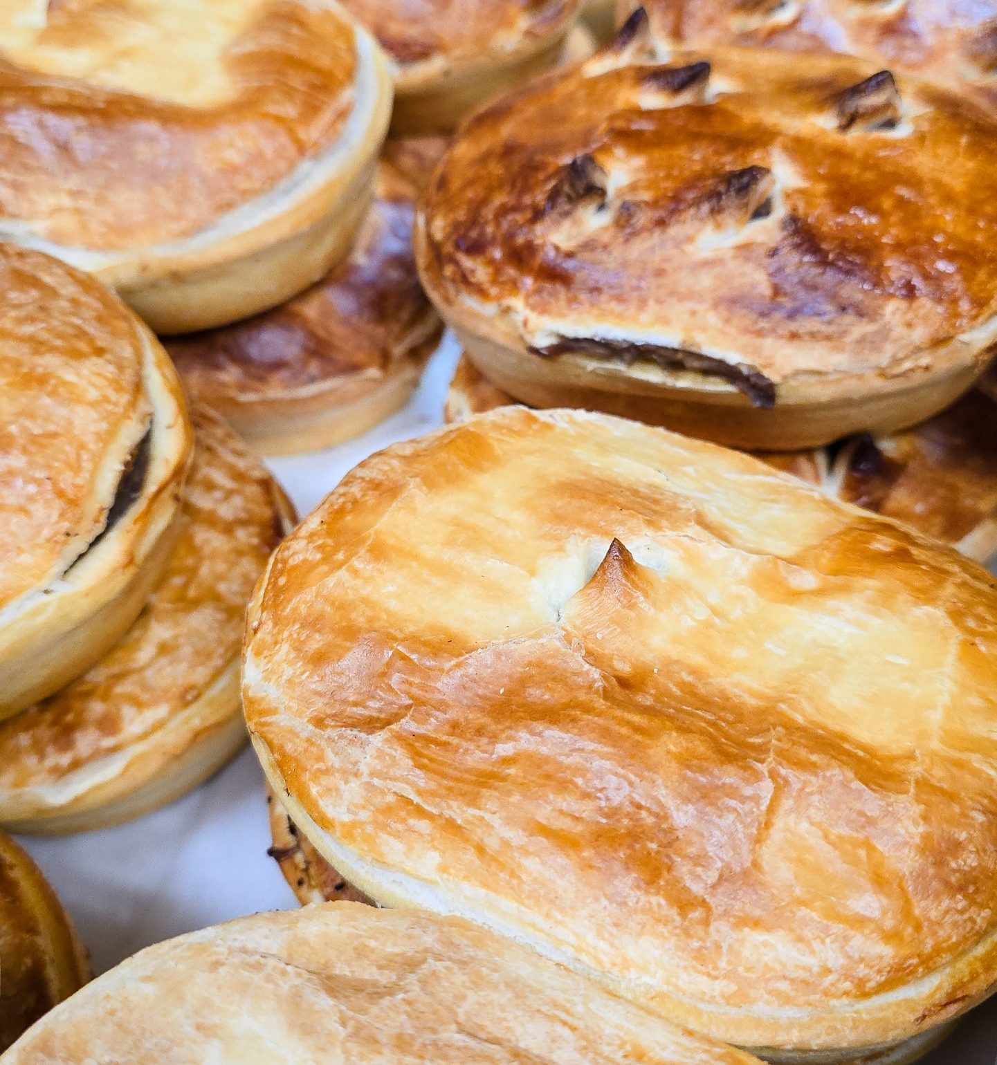 Golden crust pies stacked fresh – hearty options at Waypoints Bakery Cafe