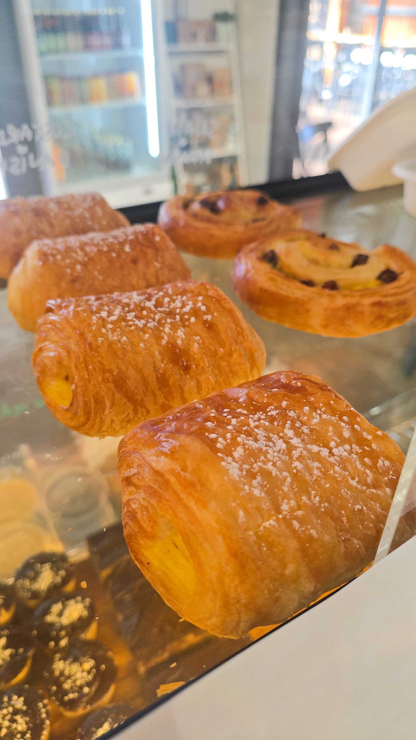 Pastries and fruit scrolls in bakery cabinet – Dwellingup cafe
